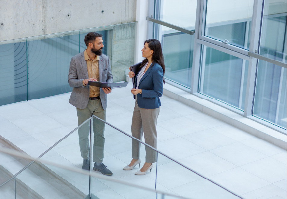 Professional conversation in office setting Getty Images 2253080600 resource center 952x661